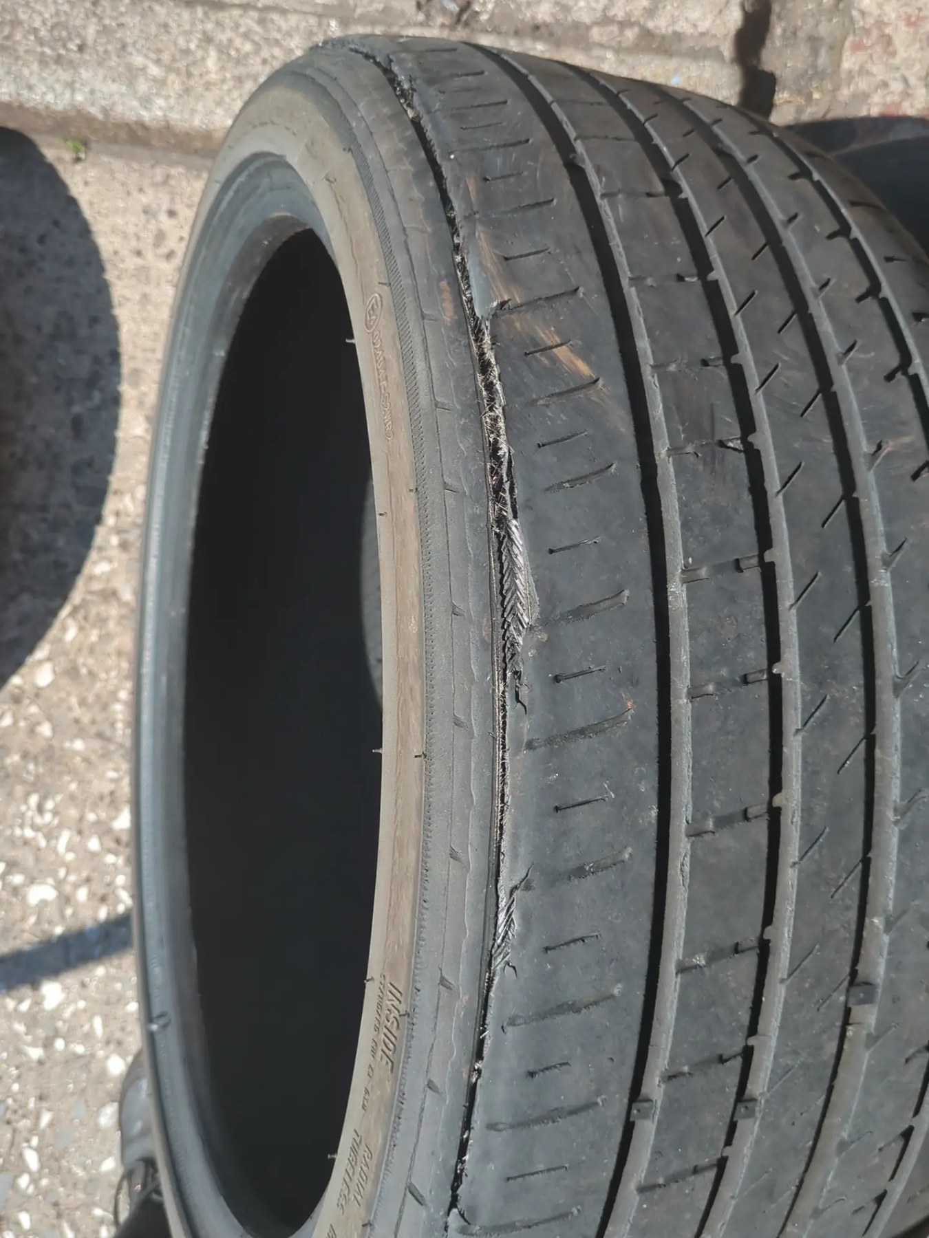 A tyre split open along its shoulder